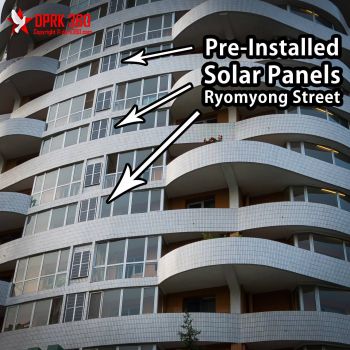 A newly built apartment block with (perhaps not the most efficient) pre-installed solar panels. <a href="https://www.facebook.com/dprk360/photos/a.238142196309616.1073741845.211159445674558/590404601083372/?type=3&theater" target="_blank">Original photo</a> North Korea pre-installed solar panels