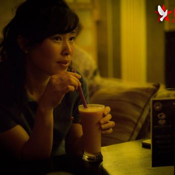 Aram's other guide, Miss Pang, enjoying her coffee. <a href="https://www.facebook.com/dprk360/photos/basw.AbomP2JteG7uhXH3hmukbSnhV3pu0nyBLOp63QJnjz2ERrLTJZixkZDqj2DhGoTeoTw_5Xmzr_M8MZgb_zO3ifd5mi4upePPkiT8hbt_zixjJqWmnJhEfNVGvtpJmOHfMVuAgk5Rc8_Ifp3qm9UEbVAkAvnlwQUWVJLDVP4VlXmrIA.241074239349745.310196159104219.361577963966038.215340508589785.299909230132912.299909170132918.309827769141058.299909253466243.299909226799579/299909226799579/?type=1&theater" target="_blank" rel="noopener">Image source</a> Sunrise cafe Pyongyang